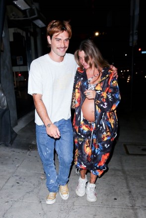 Los Angeles, CA - *EXCLUSIVE* - While the couple are still waiting for their bundle of joy, KJ Apa and his pregnant girlfriend Clara Berry step out for a night of fun. The two are seen leaving KJ's castmate and good friend, Cole Sprouse, birthday party held in Los Feliz. Pictured: Kja Apa, Clara Berry BACKGRID USA AUGUST 14, 2021 USA: +1 310 798 9111 / usasales@backgrid .com UK: +44 208 344 2007 / uksales@backgrid.com *UK Customers - Images containing children, please rasterize face before posting*
